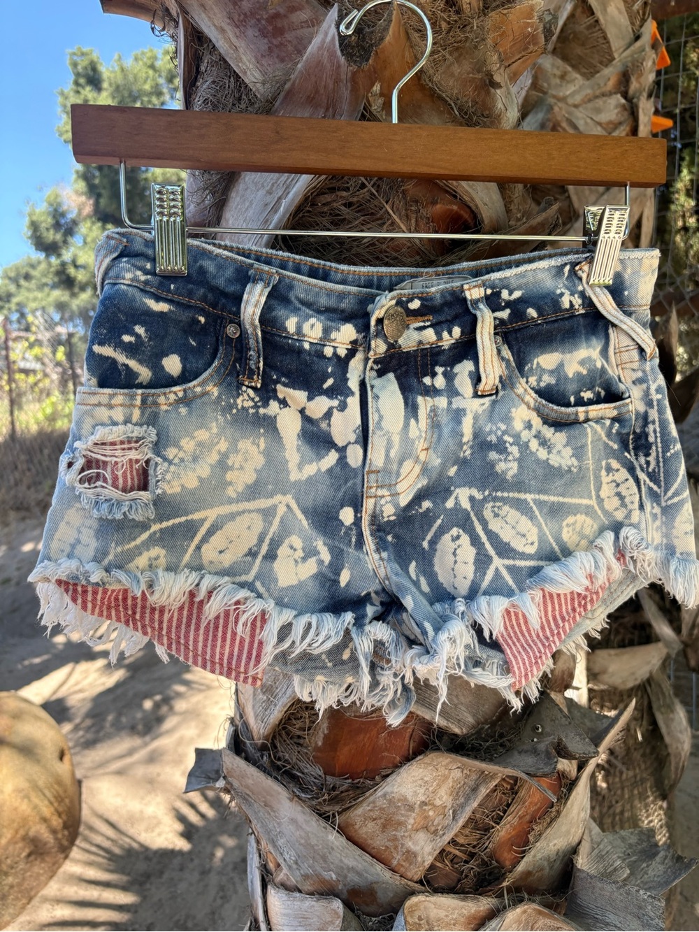 Free People Blue Tie-Dye Distressed Denim Cutoff Shorts with Red Stripe Underlay